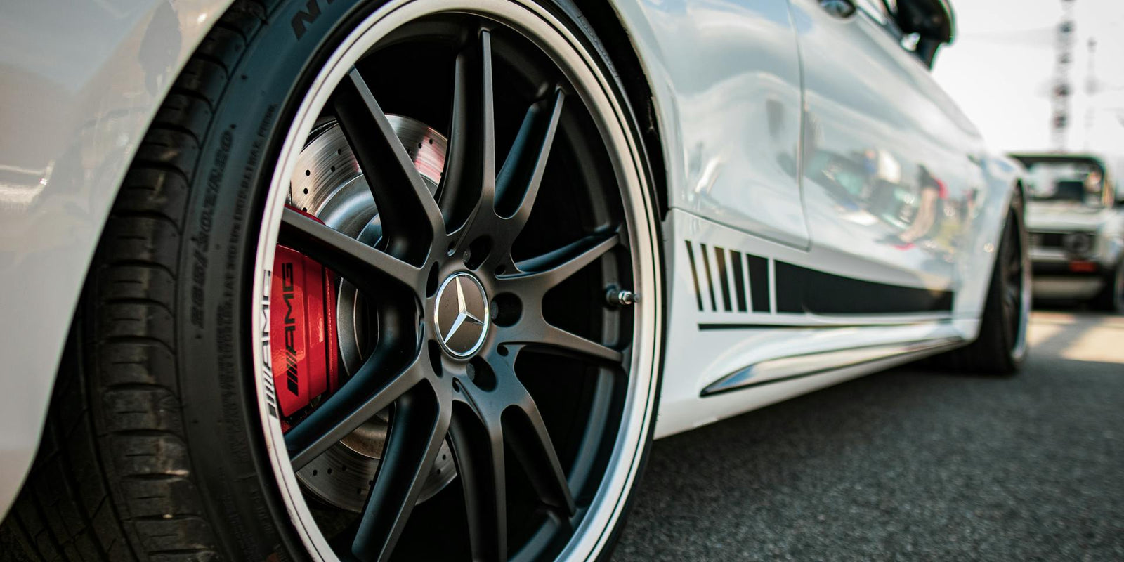 Photo by Aliaksei Semirski: https://www.pexels.com/photo/white-mercedes-benz-wheel-close-up-photo-13972881/
