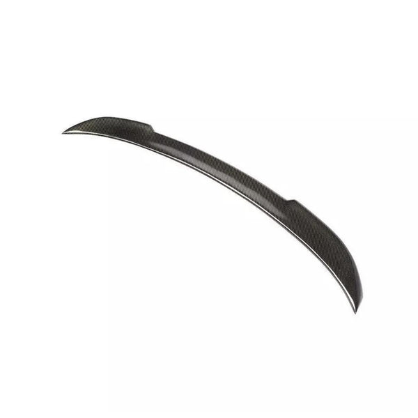 The object is a carbon fiber car spoiler, slightly curved, positioned against a plain white background.