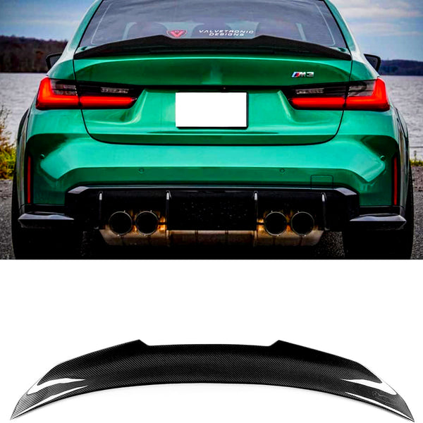 A green sports car with a "Valvetronic Designs" sticker on the rear window and an "M3" badge is parked by a lake. Below, a black carbon fiber car spoiler is displayed.