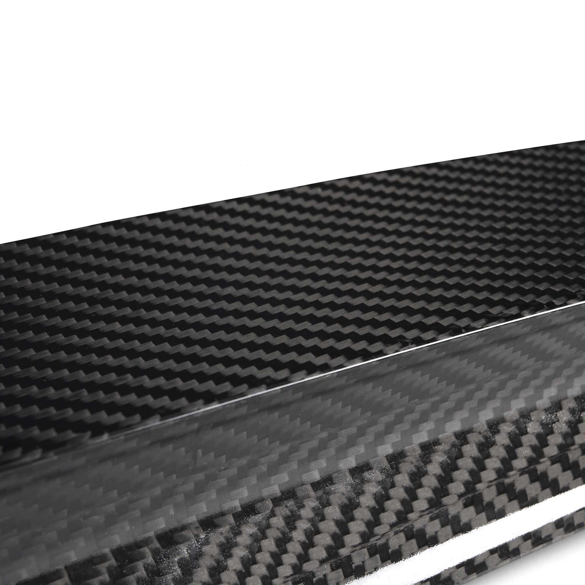 A sleek carbon fiber sheet displaying a distinctive woven pattern; it sits on a plain white background, emphasizing its glossy texture and modern aesthetic.