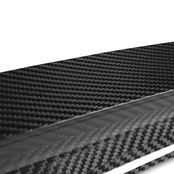 A sleek carbon fiber sheet displaying a distinctive woven pattern; it sits on a plain white background, emphasizing its glossy texture and modern aesthetic.