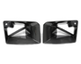 Two black, angular, carbon-fiber car exhaust trims with cutout designs are placed side by side against a plain white background.