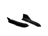Two black carbon fiber car splitters with angular designs, featuring several circular holes, are placed against a plain white background, showcasing their sleek aerodynamic form.