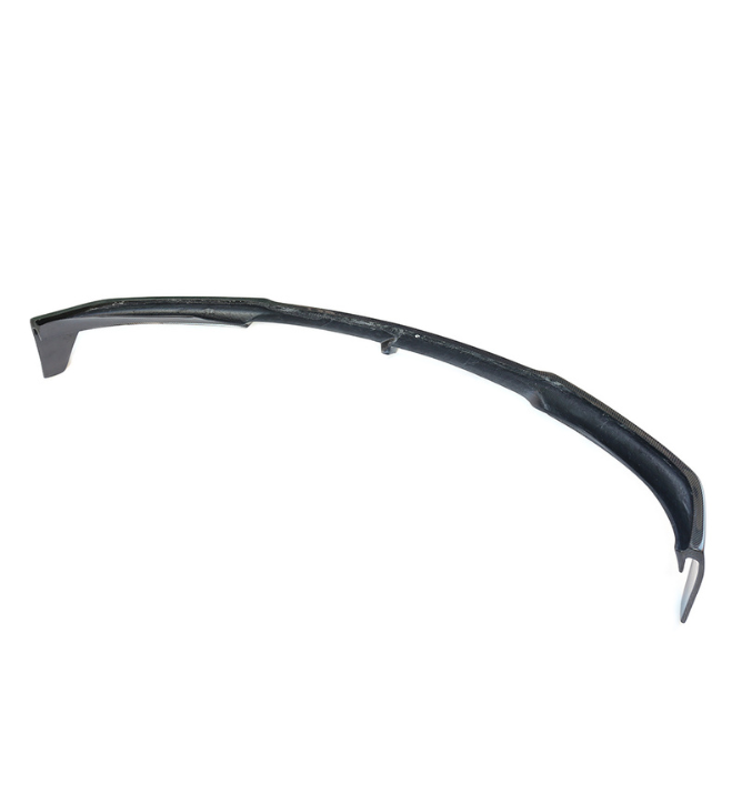 A long, curved carbon fiber object is displayed against a plain white background, showcasing its sleek, aerodynamic design.