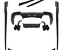 A set of black car body kit components, including bumpers, side skirts, and exhaust tips, are arranged on a white background, showcasing various parts for vehicle customization.