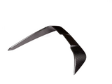 A shiny carbon fiber boomerang rests in a balanced, upright position against a plain white background, displaying a smooth, woven texture.