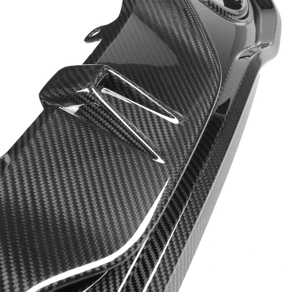 A glossy carbon fiber car part with aerodynamic fins is shown against a plain white background, emphasizing its sleek and modern design.