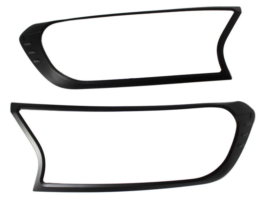 Two black plastic frames, resembling headlight covers, are positioned horizontally against a plain white background. Each frame has an asymmetric, modern design with smooth curves and sharp angles.
