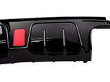 A glossy black car bumper with a red rectangular detail on the left side, set against a plain white background.