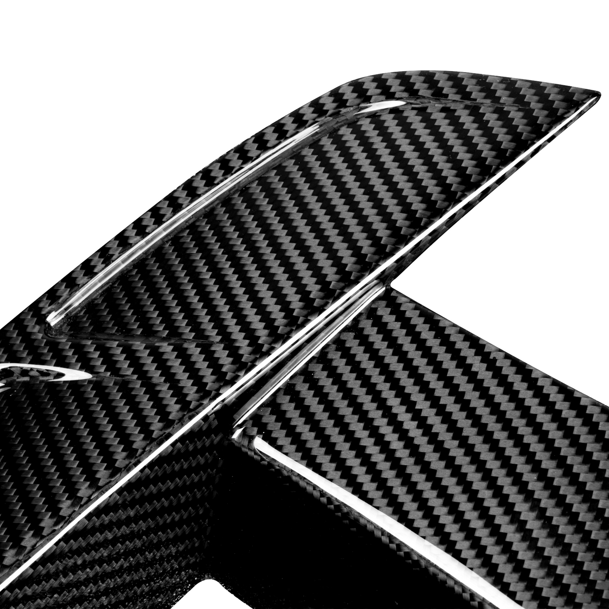 A close-up of a carbon fiber car spoiler, displaying a textured, woven pattern. The object is set against a plain white background, highlighting the material's glossy finish.
