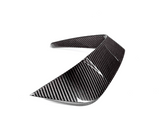 A carbon fiber car spoiler curves upward, designed for aerodynamic enhancement, displayed against a white background.
