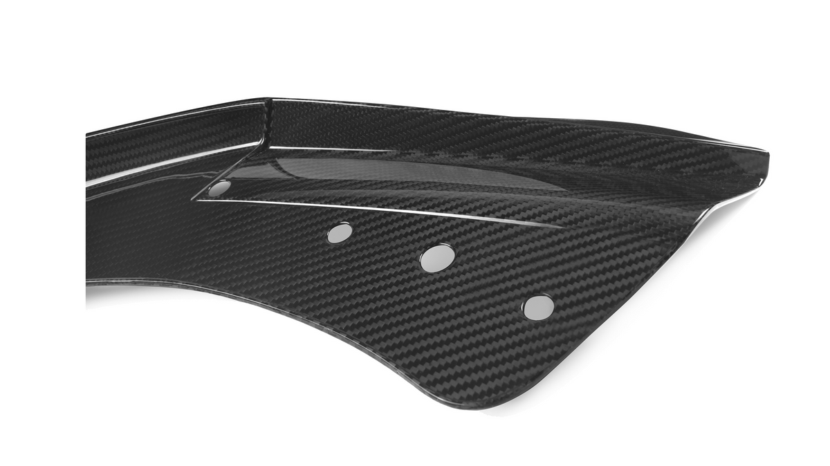 A curved carbon fiber component with four round holes is positioned against a plain white background, displaying a glossy, textured finish.