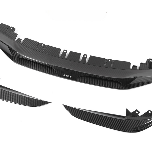 Carbon fiber car splitters arranged separately, highlighting their sleek, aerodynamic design. The central piece bears the text "SODORO," emphasizing brand identity, set against a plain white background.