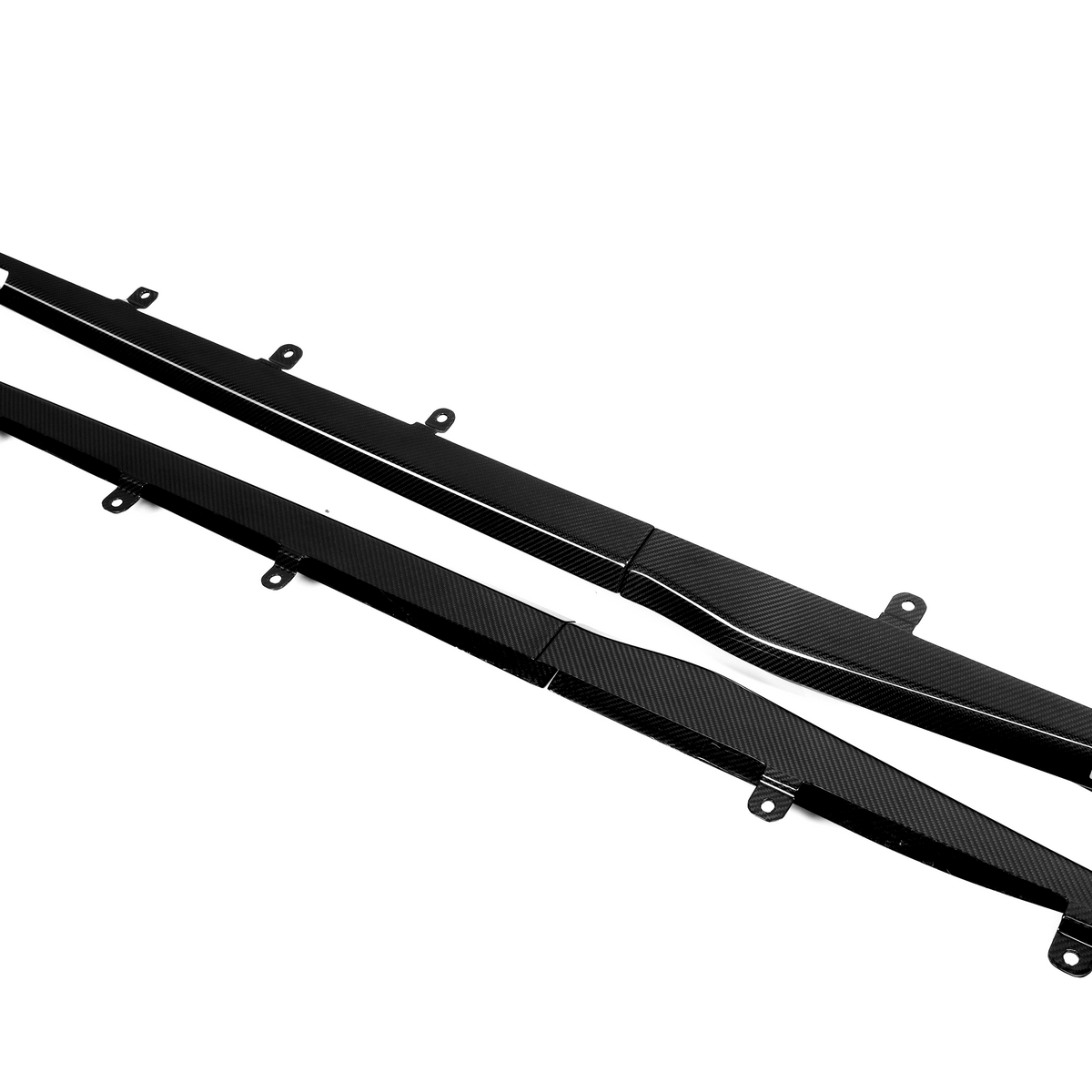 Two long, black carbon fiber car side skirts with mounting brackets lie on a white background. One piece features the text "500000."