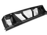 A black, carbon fiber car diffuser with sleek, angular fins designed for aerodynamic performance, placed on a plain white background.