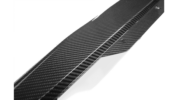 A sleek carbon fiber car component with a checkered pattern features bolt holes for attachment, set against a plain white background.