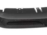 A carbon fiber car diffuser with a sleek, aerodynamic design features curved fins and vent openings, set against a plain white background.