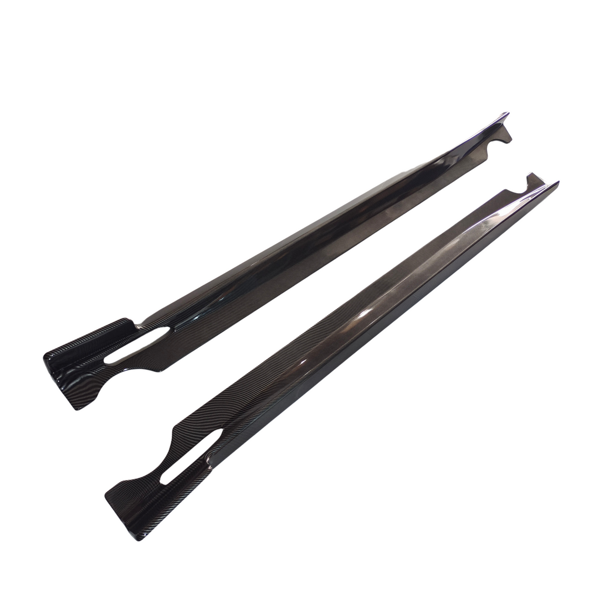 Two long, slender carbon fiber panels lie parallel on a white background, showcasing a sleek, reflective surface with precise cutouts for functional integration.