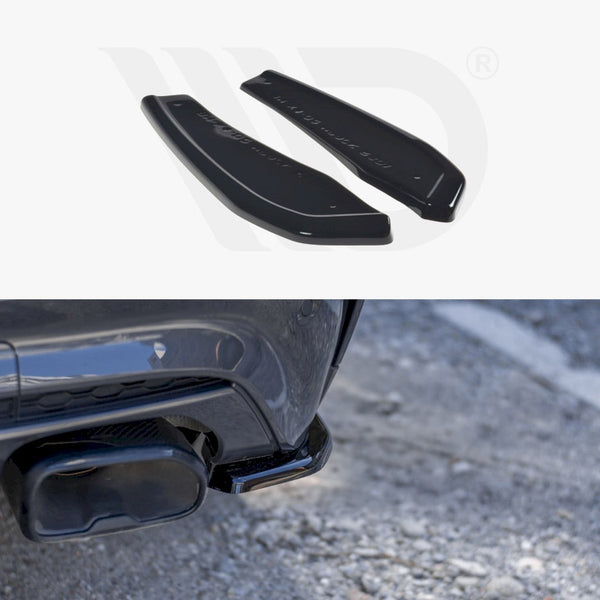Two black car bumper diffusers lie on a white surface. Below, a close-up shows a diffuser attached to a vehicle's rear bumper, parked on asphalt.