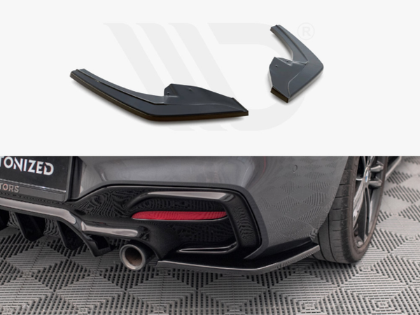 Two black aerodynamic car diffusers are displayed above a rear view of a car on a patterned floor, with an exhaust pipe and diffuser installed.