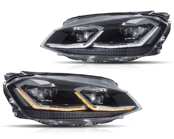 Two sleek car headlights are shown with LED accents; one displays white and the other orange lights. They are placed against a plain white background.