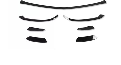 Black car spoiler kit pieces arranged on a plain white background, displaying various sizes and curved shapes, suggesting different mounting options for customization.