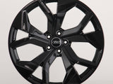 A shiny black, multi-spoke alloy wheel with an 