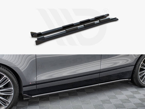 Two black side skirts are displayed above a partial view of a gray car parked on a patterned floor. The side skirts are aligned with the car's lower edge.