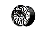 A stylish black BMW wheel rim with intricate, angular spokes, displayed against a plain white background. The BMW logo is visible at the center.