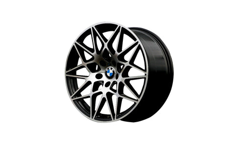 A stylish black BMW wheel rim with intricate, angular spokes, displayed against a plain white background. The BMW logo is visible at the center.