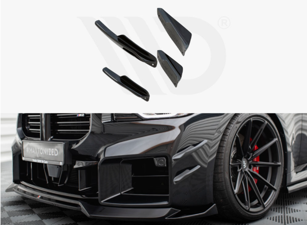 Various black car body parts are displayed, with a sleek black car featuring red brake calipers and a modified front bumper on a checkered floor. The license plate reads "WRAPTOMIZED."