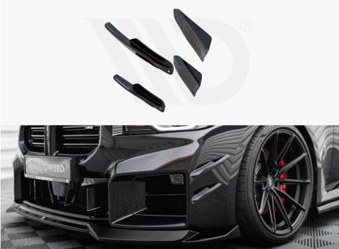 Various black car body parts are displayed, with a sleek black car featuring red brake calipers and a modified front bumper on a checkered floor. The license plate reads "WRAPTOMIZED."