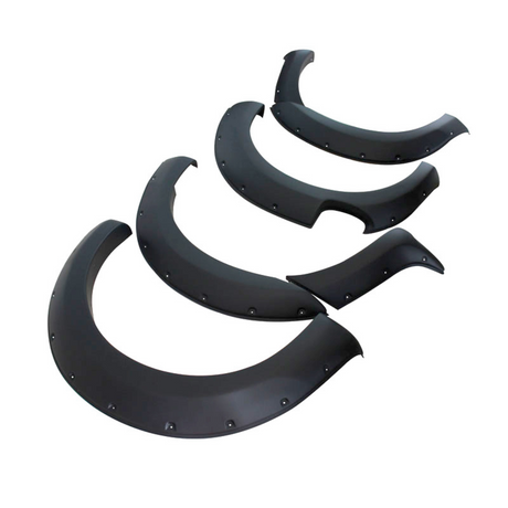Four black fender flares are arranged on a white background, displaying segments with bolt details and smooth curves, typically used for automotive customization and protection.