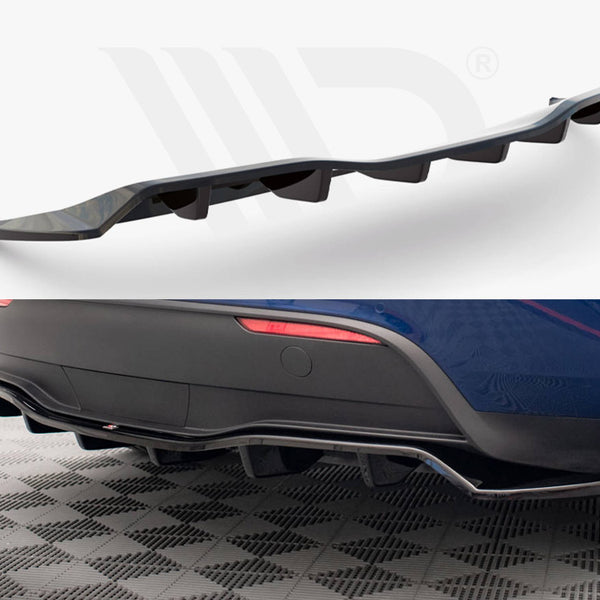 Curved black car diffuser, with angled fins, is displayed against a white backdrop and attached under the rear of a blue car, highlighting its sporty aesthetic on a checkered floor.