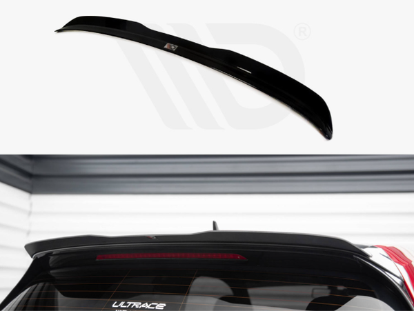 A black car spoiler is displayed on a white background above an image showing it installed on a car's rear roof, viewed in a garage. Text on the car window: "ULTRACE2".