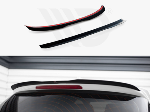 Two black car spoilers rest on a white background, displayed above a white vehicle rear window. The vehicle features a red brake light, set within a garage-like space.