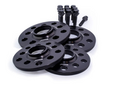 Four black wheel spacers with multiple holes, labeled 