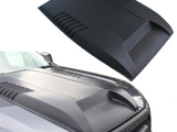 A matte black car hood with aerodynamic vents is displayed separately and installed on a dark vehicle, enhancing its sporty appearance. The word 
