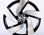 A metallic car wheel with a five-spoke design featuring a central logo; it rests against a plain white background.