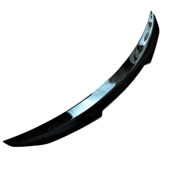 A sleek, black car spoiler with a glossy finish is displayed against a plain white background, highlighting its curved aerodynamic design.