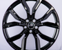 A glossy black alloy wheel with a five-double-spoke design, featuring the "Range Rover" logo at the center, displayed against a plain white background.