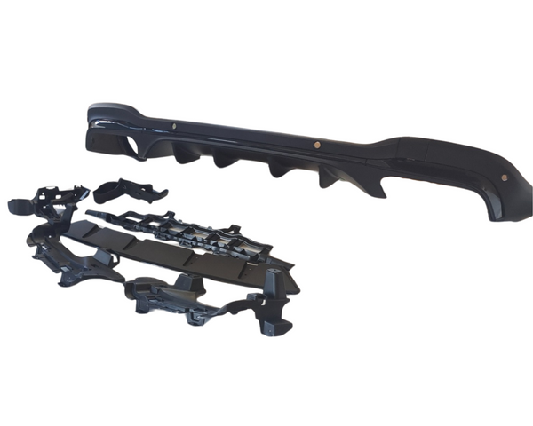 A shiny black automotive bumper with aerodynamic features is positioned on a white background, accompanied by various mounting brackets and components arranged below it.