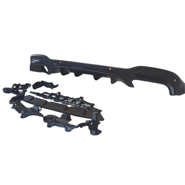 A shiny black automotive bumper with aerodynamic features is positioned on a white background, accompanied by various mounting brackets and components arranged below it.