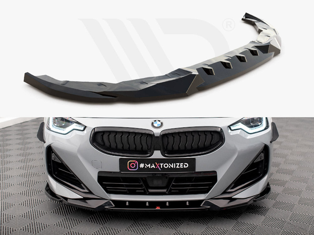 A black car splitter is displayed; the action is showcasing its design. Below, it's installed on a grey BMW, enhancing the front in a showroom with patterned flooring. Text: "#MAXTONIZED."