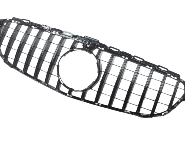 Black car grille with vertical bars and central circular opening; displayed on a white background.
