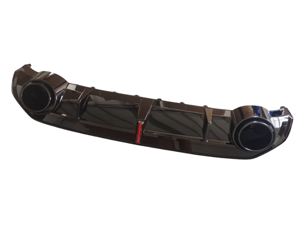 A glossy black car bumper with two circular exhaust ports is displayed against a plain white background, featuring a small red detail in the center.