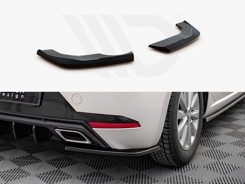 Two glossy, black plastic components are displayed. They are installation-ready extensions. Below, one is fitted to a white car's rear fender, sitting on a checkered floor mat.