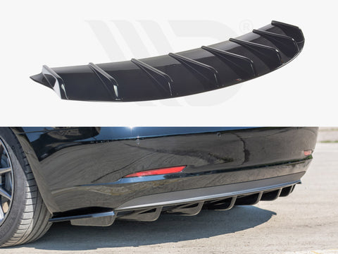 A black car diffuser with fin-like structures shown detached above, and attached below to the rear bumper of a black car parked on a concrete surface. No text present.