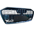 A black car grille displays three circular emblems at the top and “quattro” text at the bottom, featuring a honeycomb pattern.