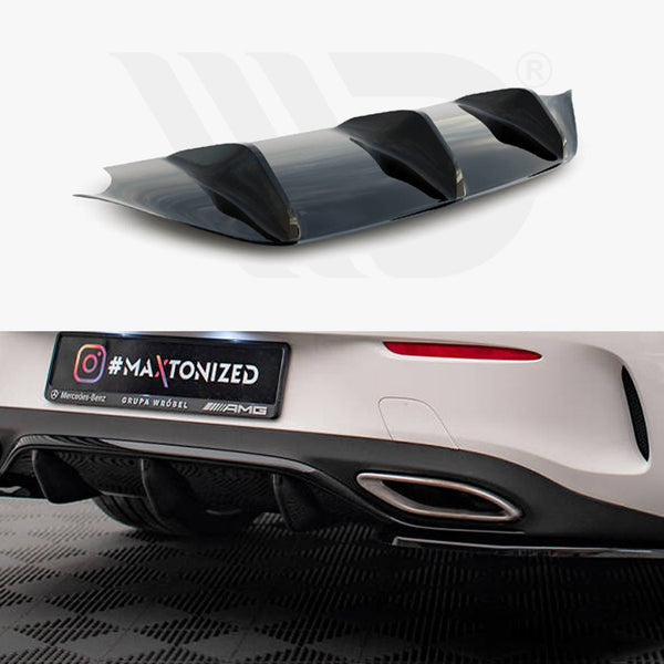 A car diffuser is displayed in two contexts: a close-up view above and installed on a white car below, with text reading “#MAXTONIZED, Mercedes-Benz, GRUPA WRÓBEL, AMG.” The car is parked on a checkered floor.